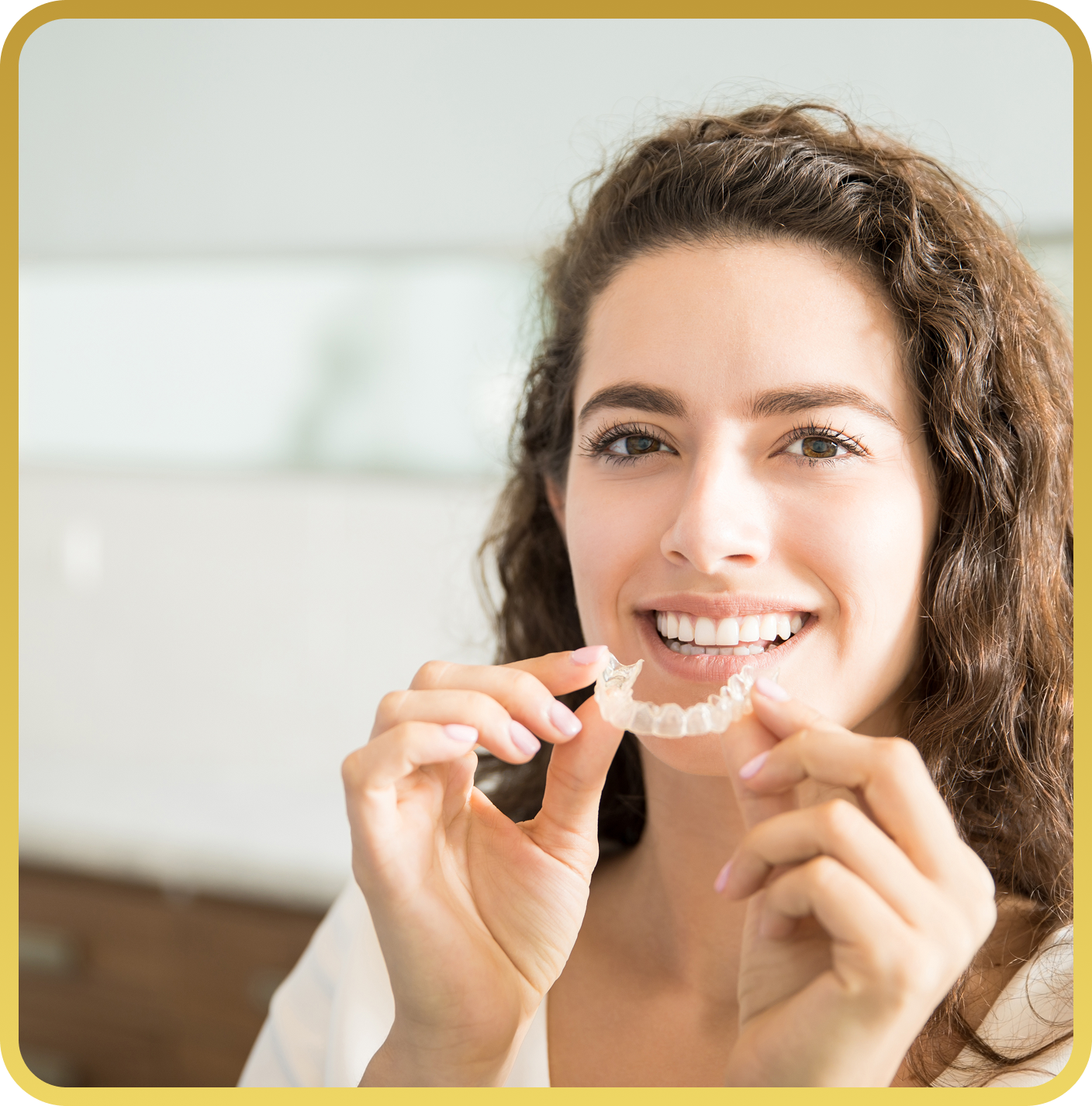 portrait beautiful patient holding orthodontic retainers dental clinic 1.png