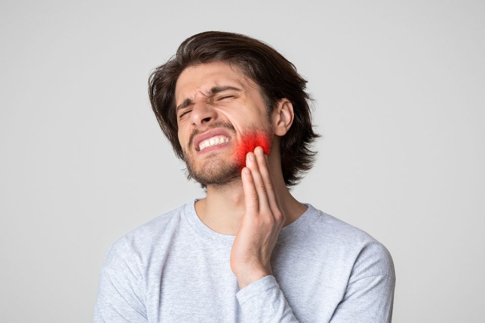 man with tooth infection